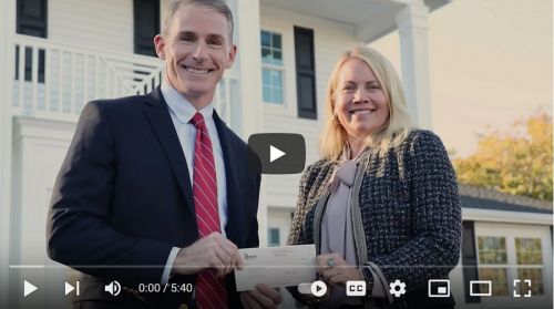 Chamber representative receiving donation check